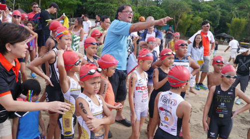 With Rick Reyes of the Triathlon Association of the Philippines giving the children (some racing their first triathlon) some last minute race reminders