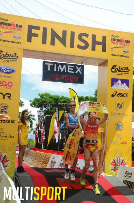 2015 Ironman 70.3 Asia Pacific champion Tim Reed makes it to the finish line two seconds ahead of fellow Australian Tim Van Berkel