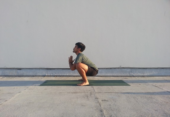 This yoga pose also stretches adductors and Achilles tendons and creates space in the back