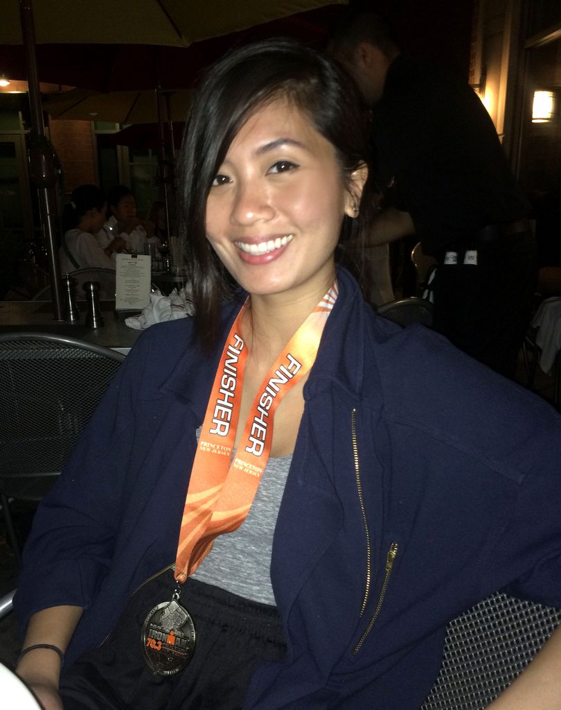 Trying on the Princeton finisher's medal—note the unplanned tan