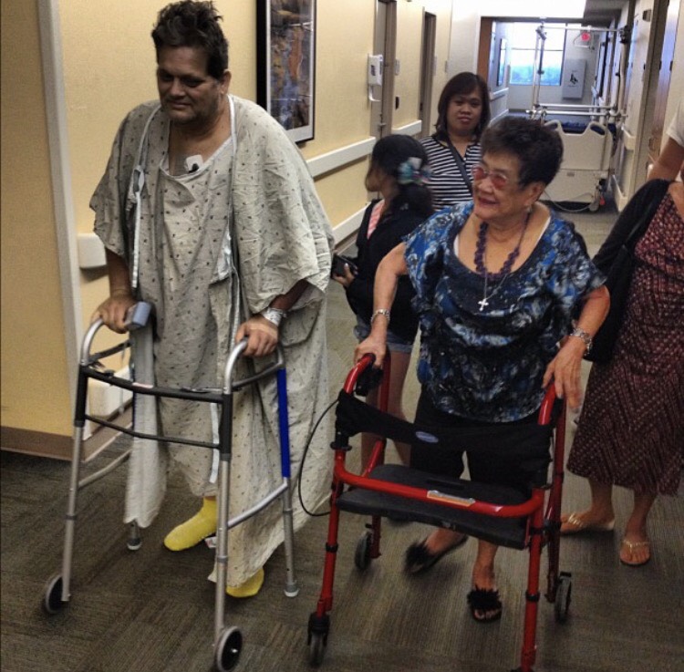 Robert Blodgett "racing" with his mother-in-law Jacinta Menodiado on walkers while recovering from his a heart attack in 2012