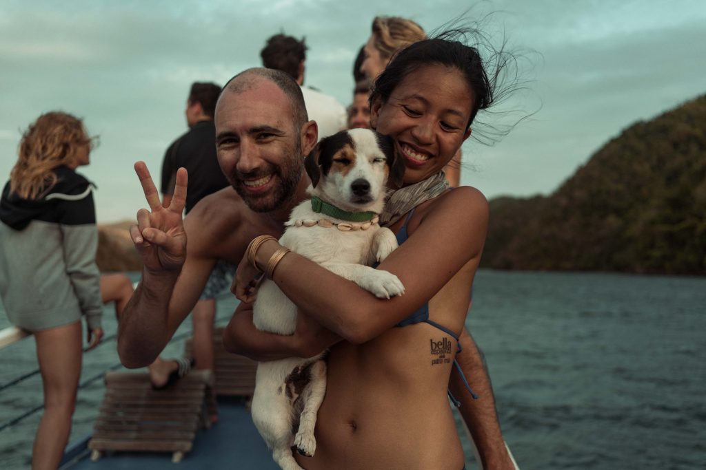 "On board a TAO Philippines boat with captain Harry—they have Jack Russells aboard almost every ship and it’s the most adorable thing because they run around the boat when the anchor is about to drop, swim with the guides (his trusty best friend was Jimboy whose back he would just ride on whenever Jimboy would swim close enough)"