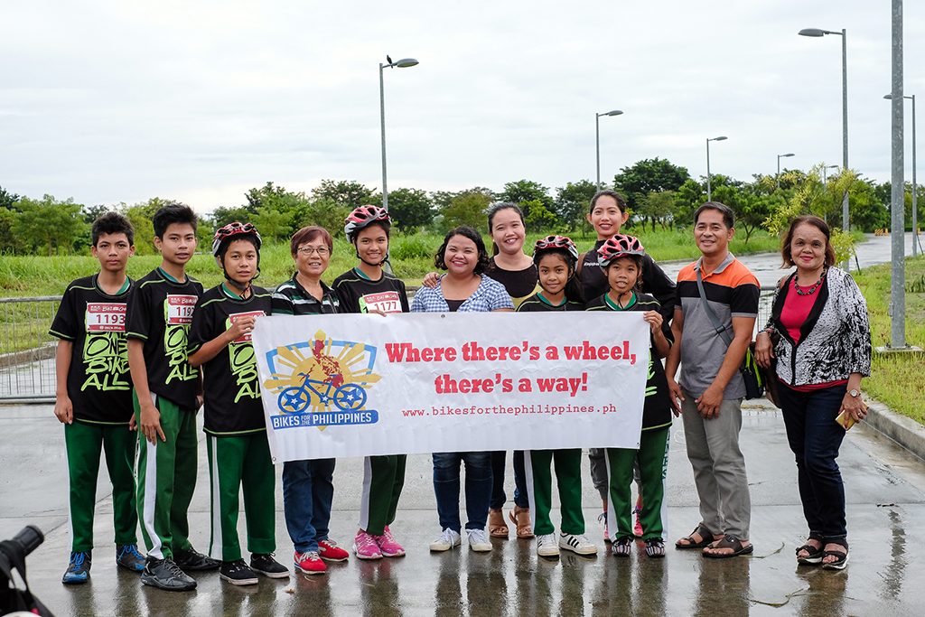 Students and representatives of Talahib Pandayan National High School, the beneficiaries of Bike for the Philippines