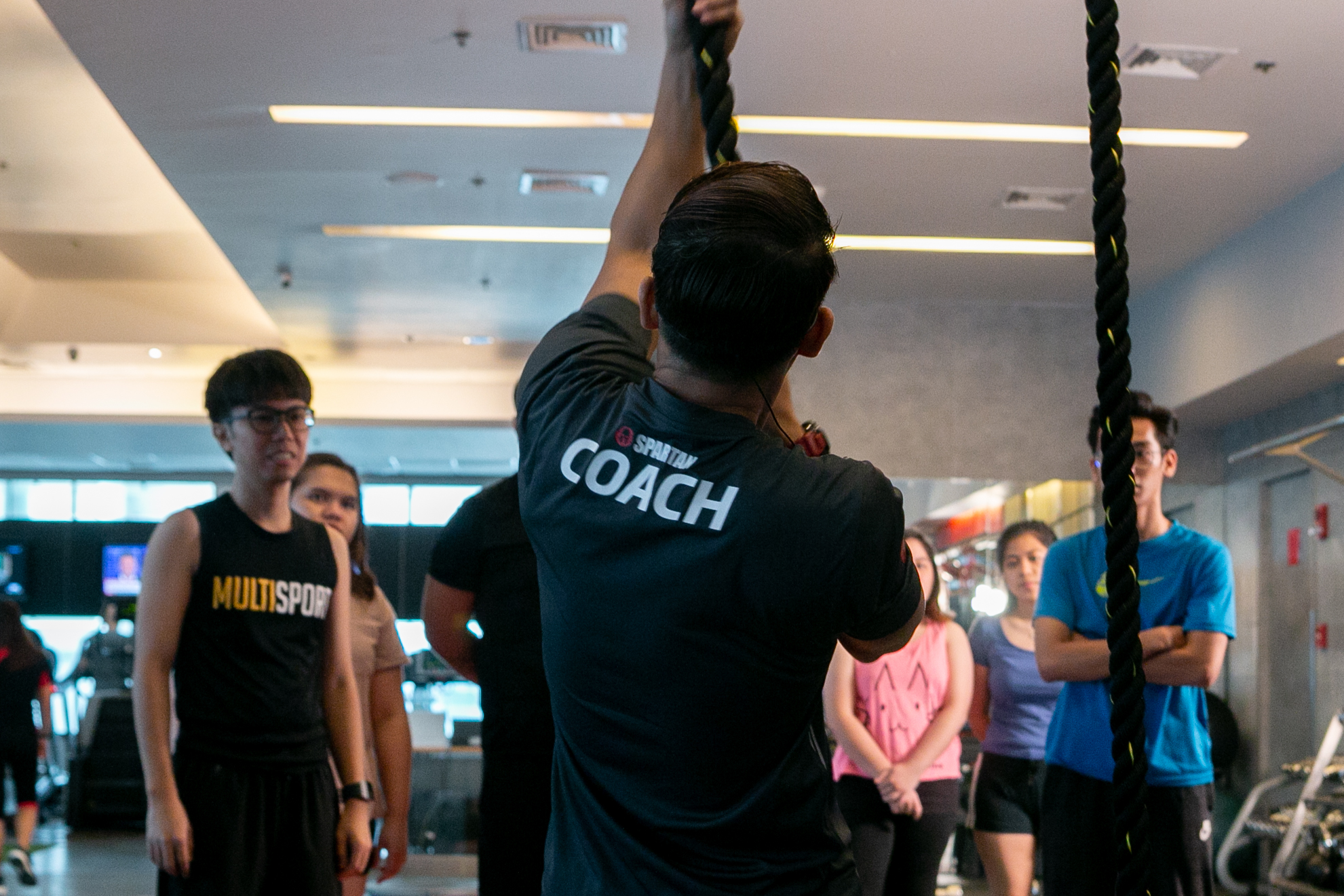 Coach Andie showing our little team how to rope climb