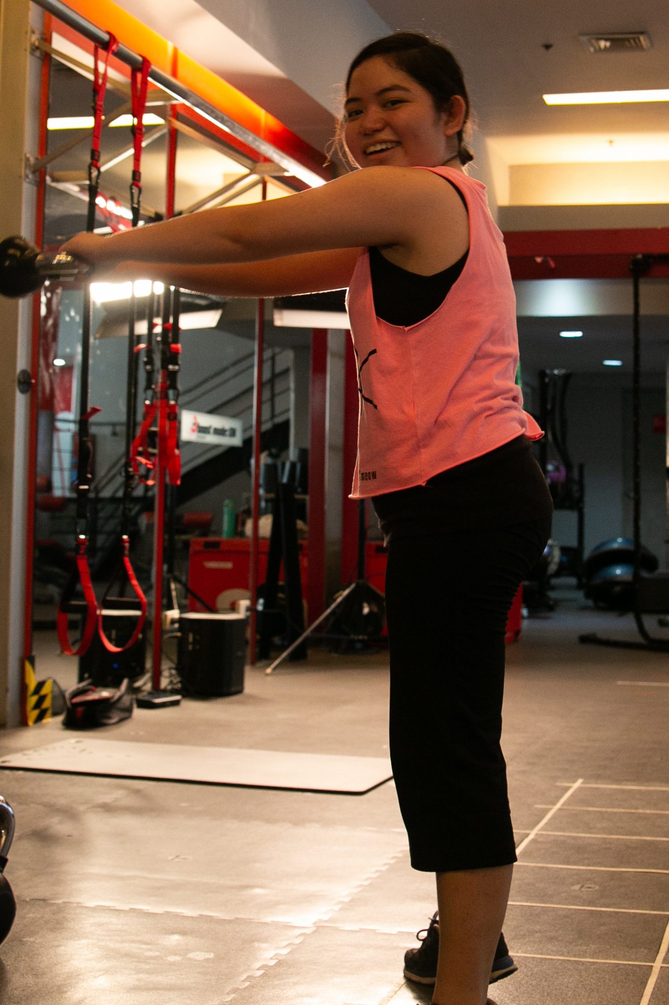 Graphic artist Marian Hukom doing kettlebell swings