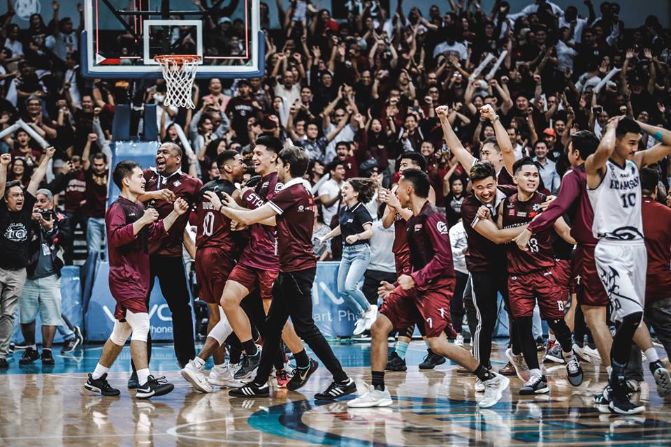 The entire coaching staff, bench, and the sea of maroon celebrate their huge victory last Saturday