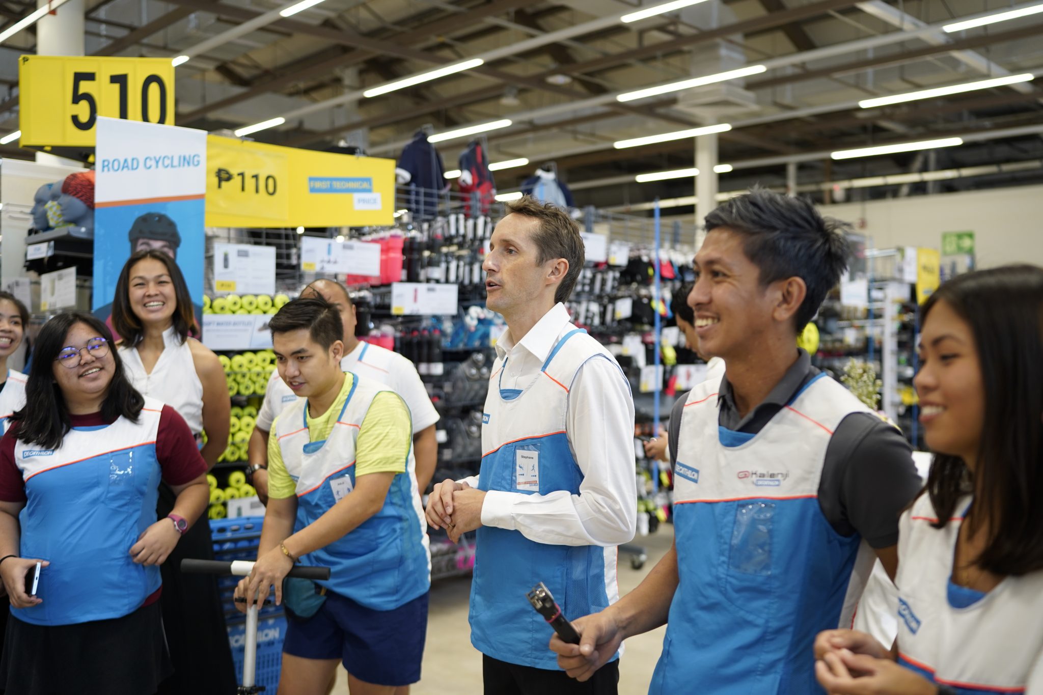 Decathlon Pasig store leader Stephane Baraillier (middle) and his team encourages customers to try their products before buying it