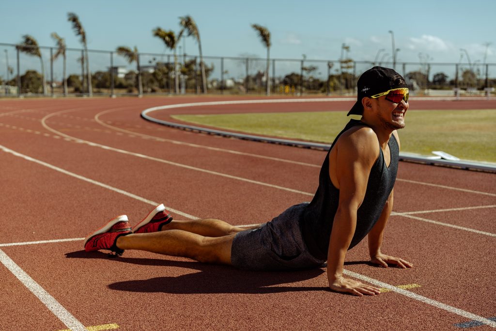 Running, says Matteo Guidicelli, is the base for everything as he does some stretches in the track oval