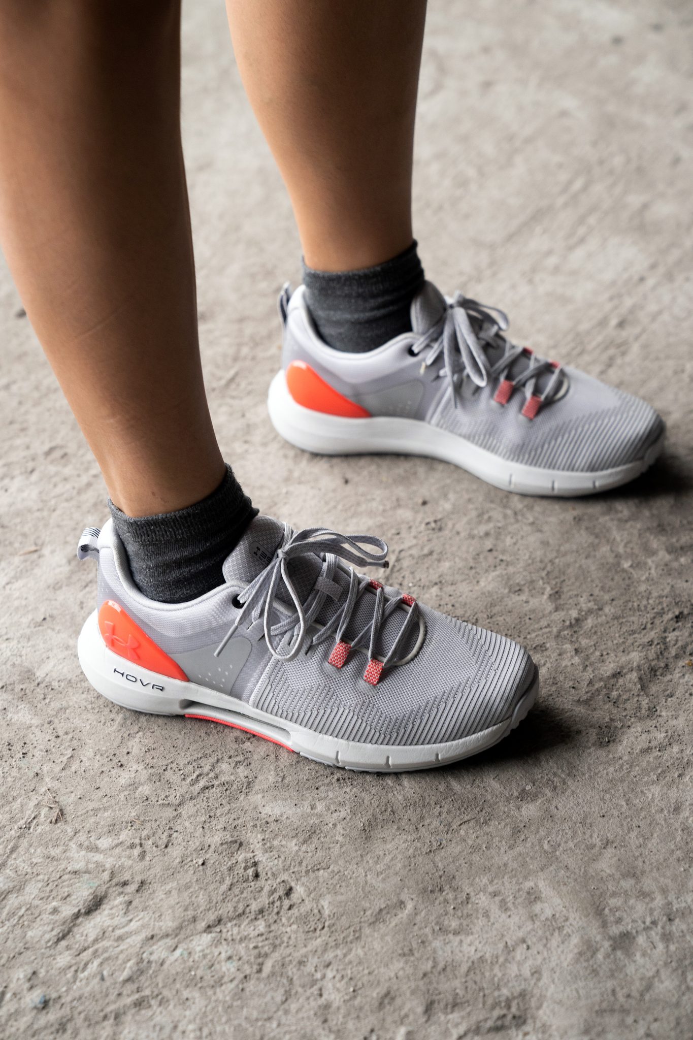 The Halo Gray colorway with a splattering of orange follows the usual Under Armour visual flair