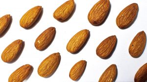 Almonds contain fat, protein, and fiber that directly improve blood sugar levels
