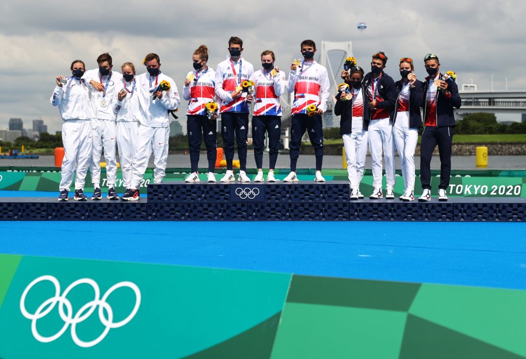 Jonny Brownlee stands proud with Team Britain alongside silver medalists Team USA and bronze medalists Team France