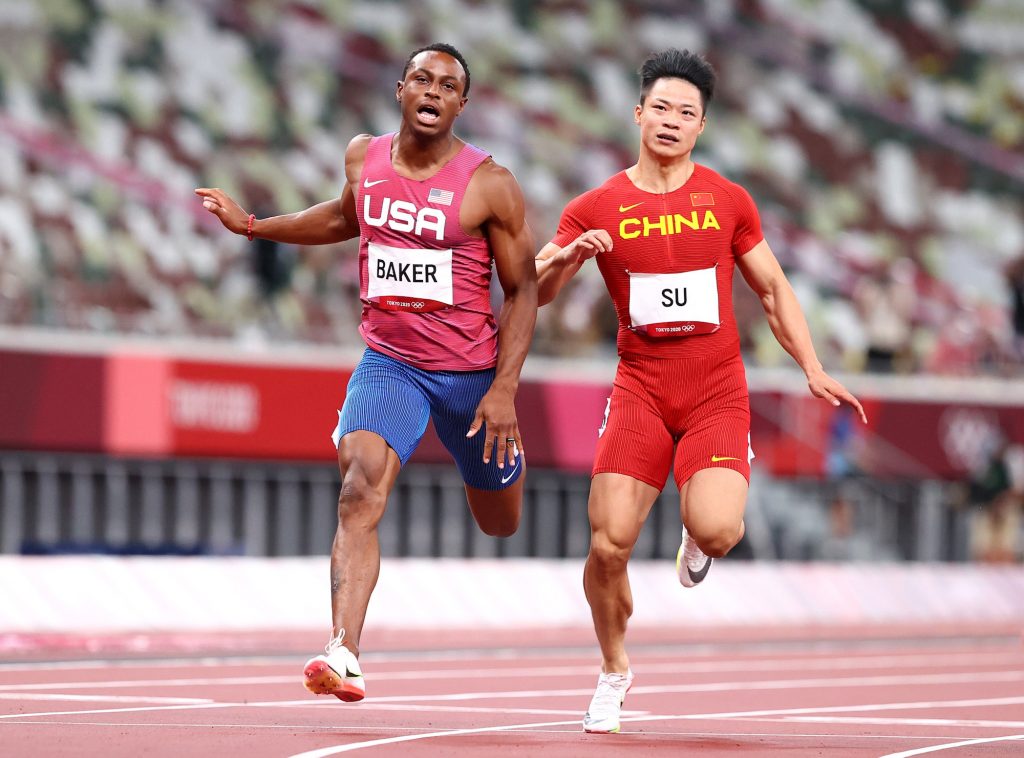 Su Bingtian of China and Ronnie Baker of United States in action