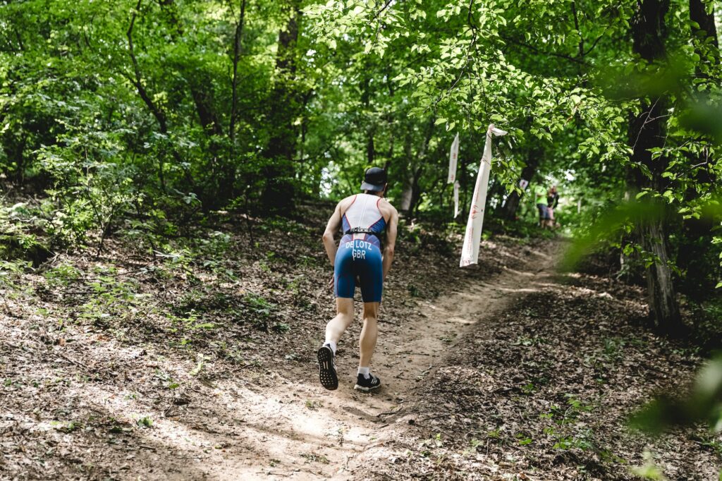 If there are off-road portions on the run course, add some trail running into your weekly Olympic distance training runs