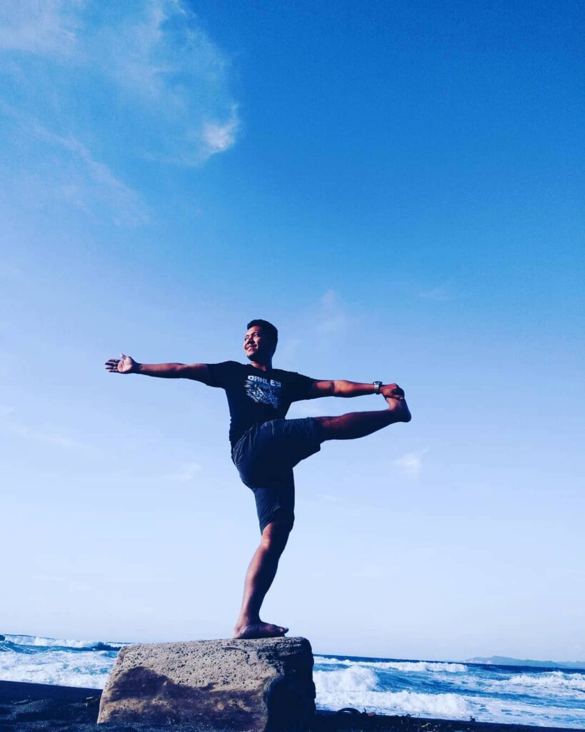 Ferdz Decena practicing yoga in La Union