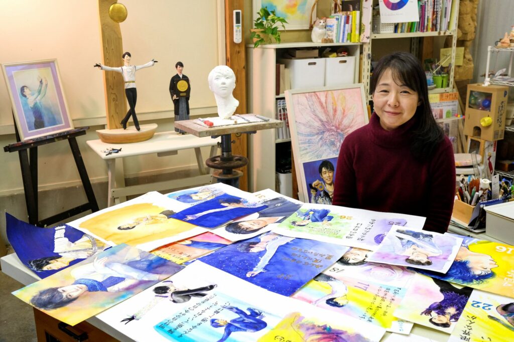 Artist Yumi Matsuo displaying her homemade art of Japanese figure skater Yuzuru Hanyu—from paintings to wood carvings—at her atelier in Joetsu, Niigata prefecture