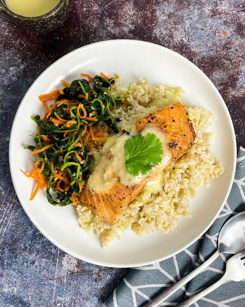 Daily's Diet's baked lemon pepper salmon with garlic butter spinach over brown rice