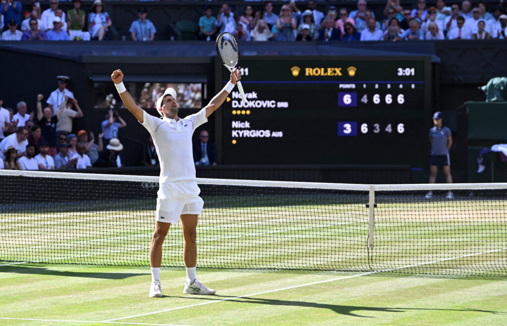 Novak Djokovic celebrates after winning the men's singles final against Australia's Nick Kyrgios | Photo by Toby Melville/Reuters