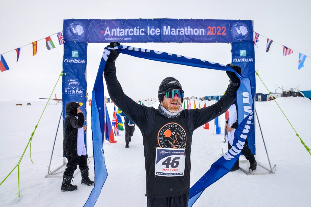 Irish runner Sean Tobin reacts as he wins the Antarctic Ice Marathon, in Union Glacier, Antarctica,