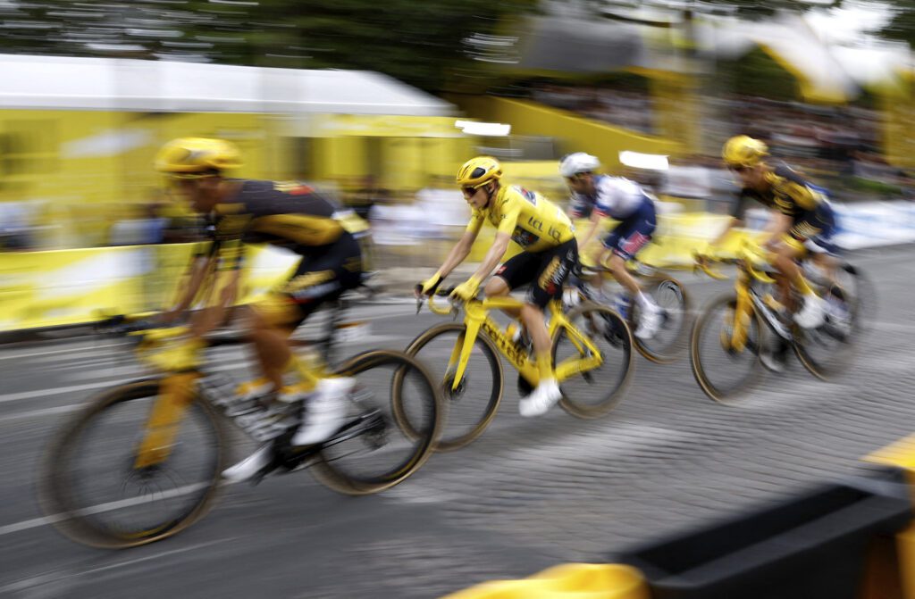 Team Jumbo–Visma's Jonas Vingegaard in action with riders during stage 21 | Photo by Stephane Mahe/Reuters
