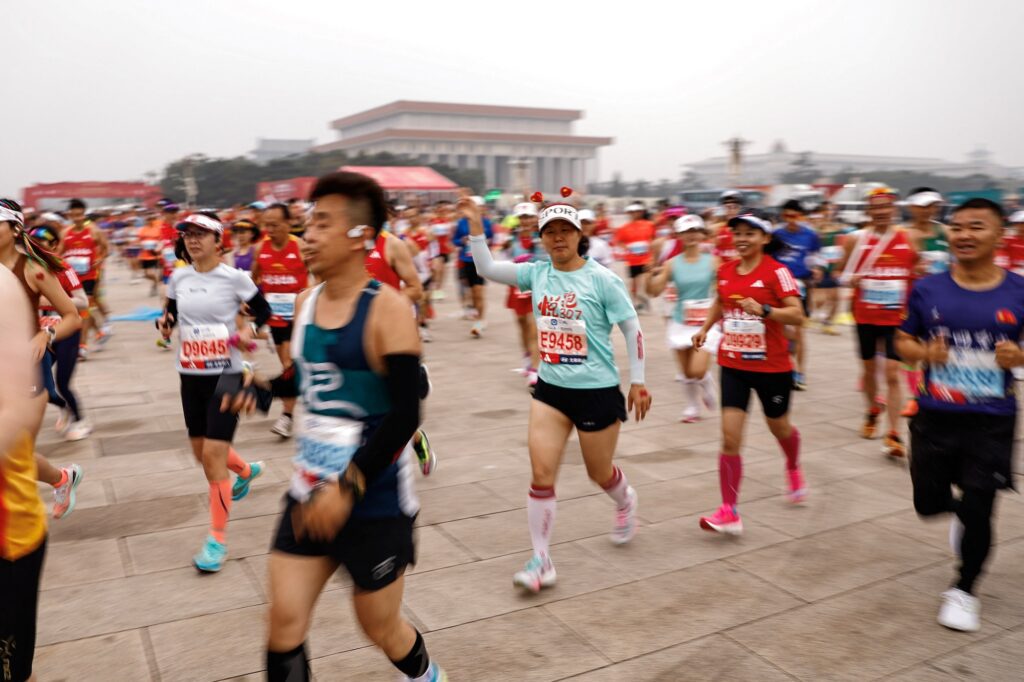 Participants take part in the Beijing Marathon, at Tiananmen Square in Beijing