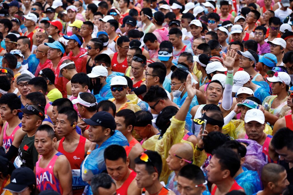 Participants wait before the Beijing Marathon