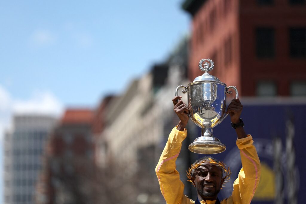 Sisay Lemma of Ethiopia poses with the trophy after winning the professional Men's Division during the 128th Boston Marathon on April 15, 2024 in Boston, Massachusetts. Paul Rutherford/Getty Images/AFP (Photo by Paul Rutherford / GETTY IMAGES NORTH AMERICA / Getty Images via AFP)