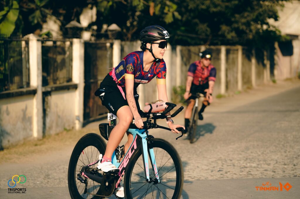 Century Trihard’s Alexandra Faith Garcia, also Ms Aura International 2021, on her way through the long bike route of Paoay-Suba-Balacao Road. She won third in the overall female standard distance category